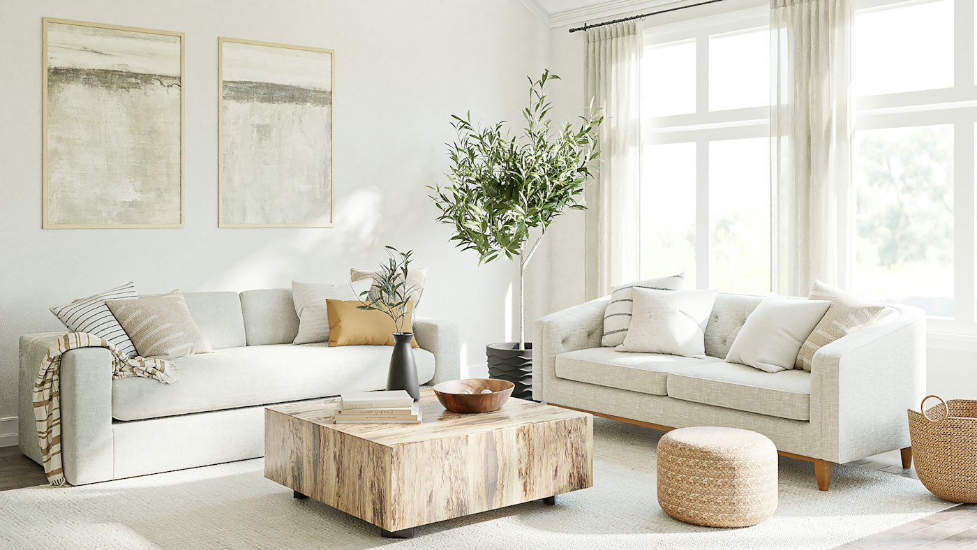 Bright living room with cream sofas, a stone coffee table and tall windows