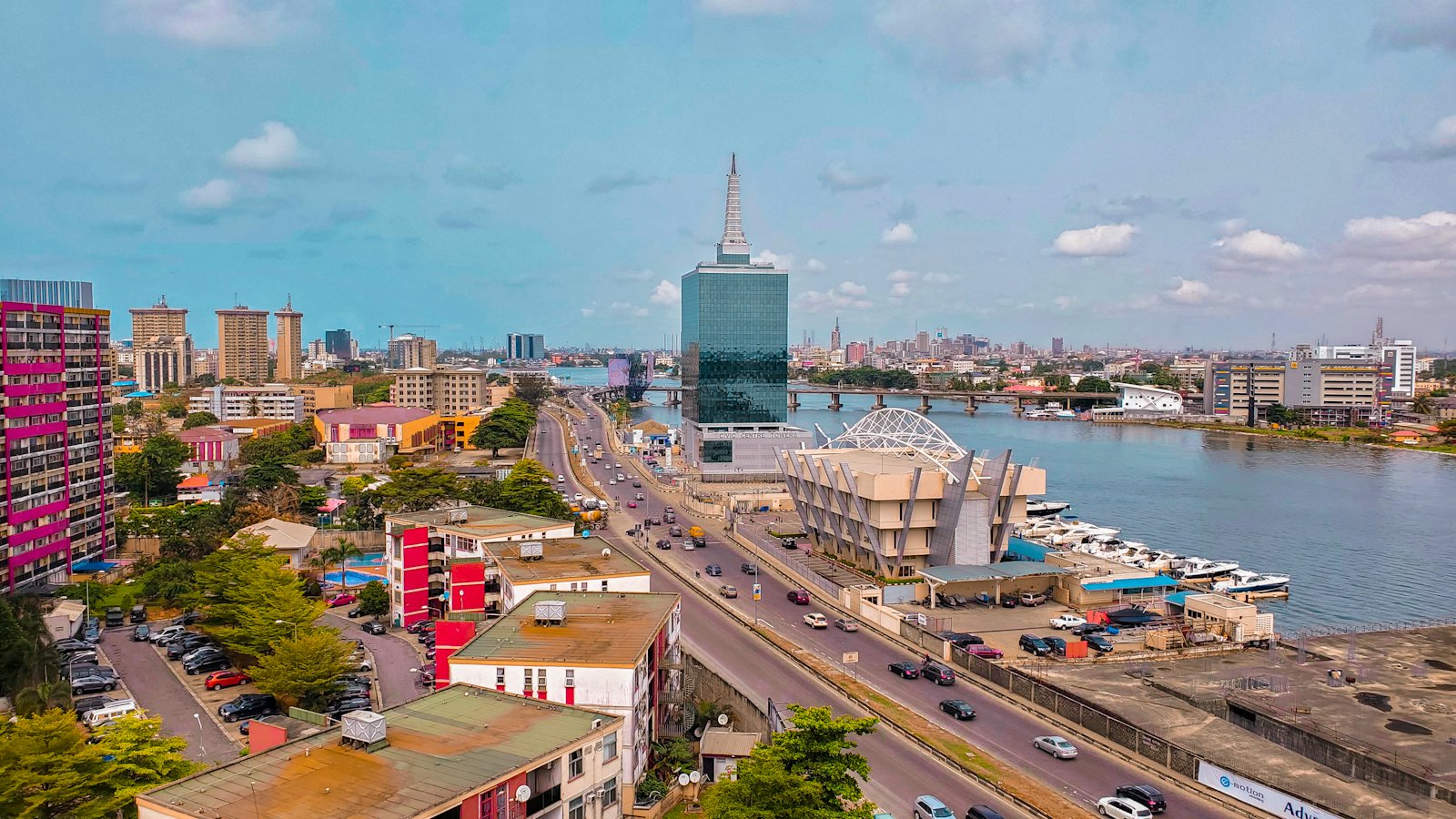 Aerial view of Lagos with towers, waterfront and a busy expressway
